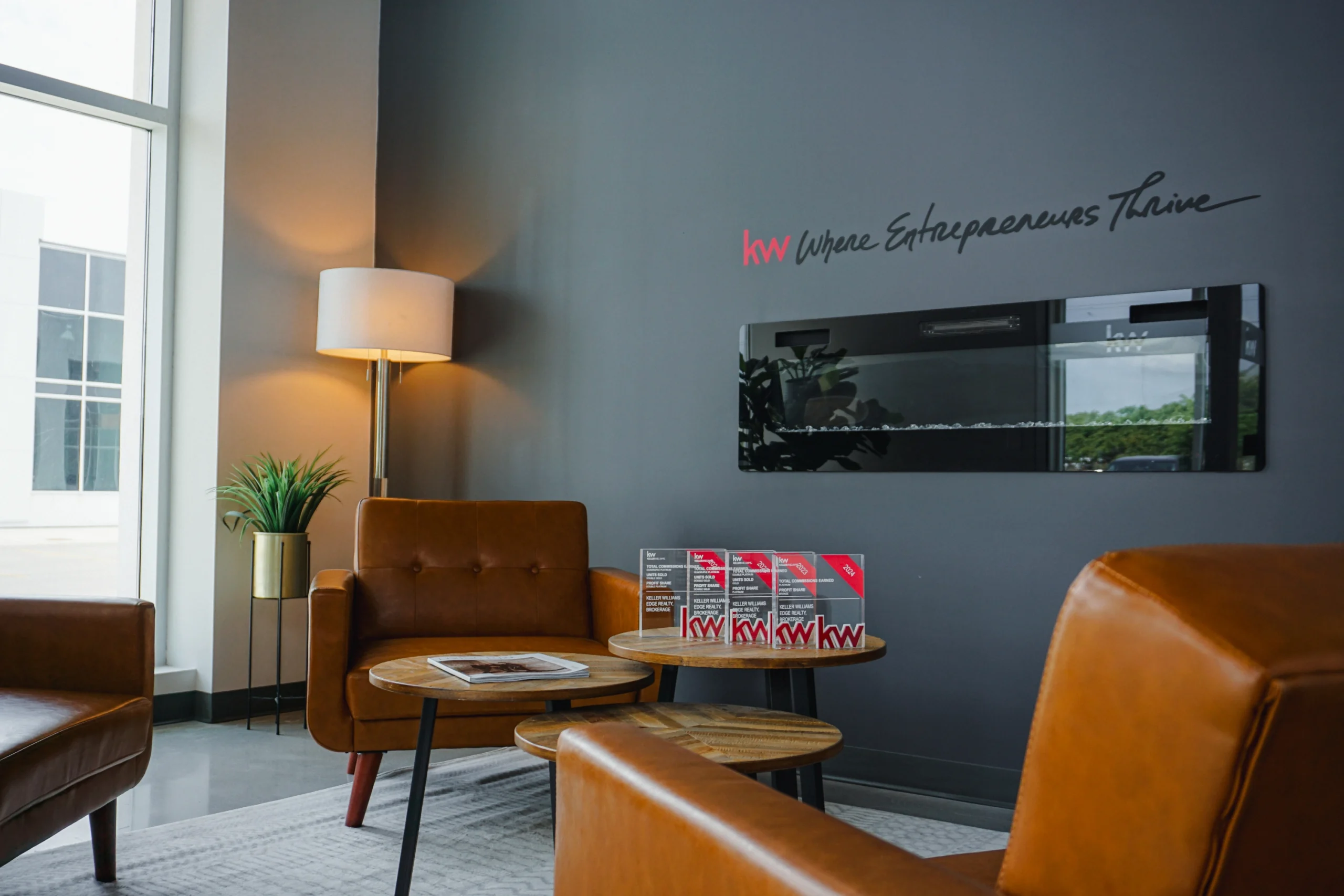Photo of the interior of the KW Edge office waiting area during the day.